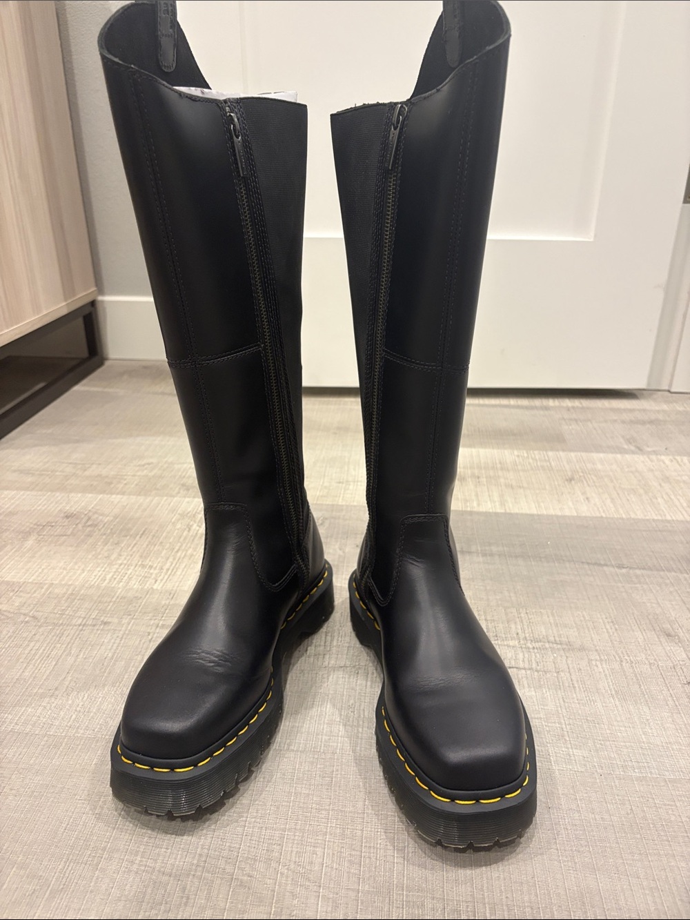 Dr. Martens Black Leather Knee-High Boots with Yellow Stitching